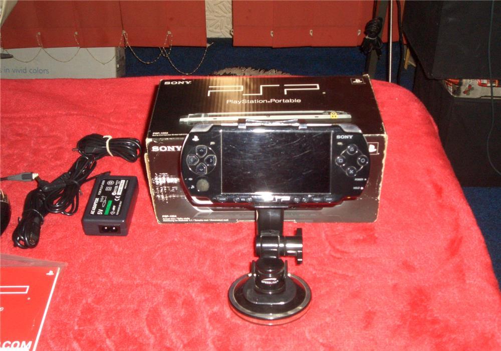 Sony PSP La Cutie cu 12 jocurii Originale +Filme Accesori Diverse Conexiune Internet jocuri multi